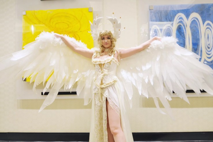 A woman dressed in a winged costume.