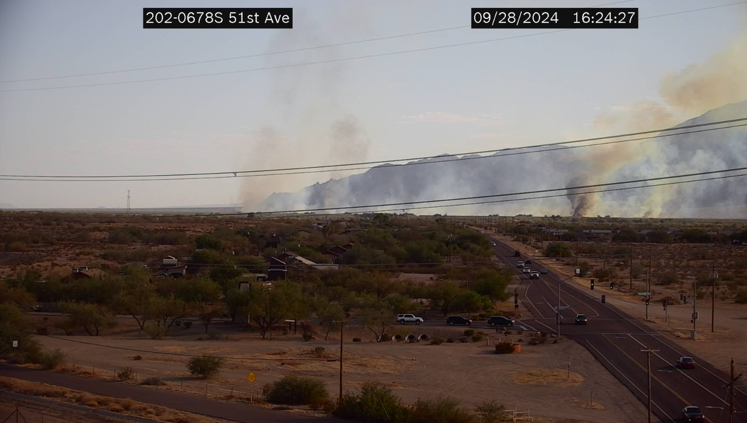 a traffic camera catches a brush fire burning