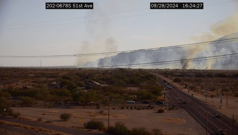 a traffic camera catches a brush fire burning