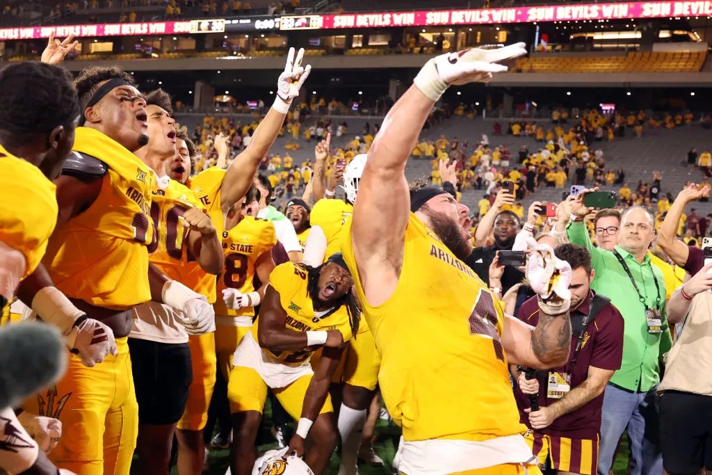Running back Cam Skattebo of the Arizona State Sun Devils celebrates with teammates after the Sun Devils defeated the Mississippi State Bulldogs on September 7.