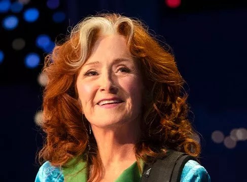 An older woman with red hair.