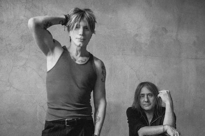 A black and white photo of two men.