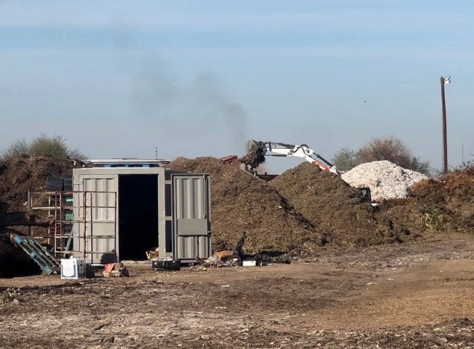 excavators and mounds of dirt