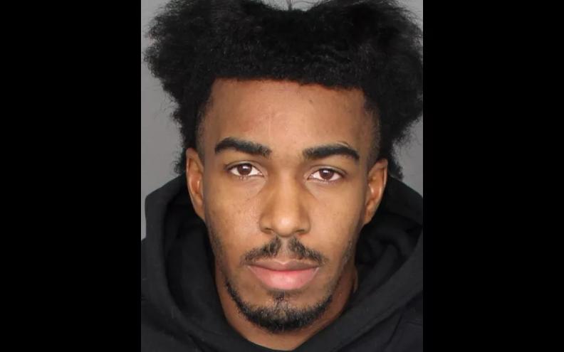 a mugshot of a young man