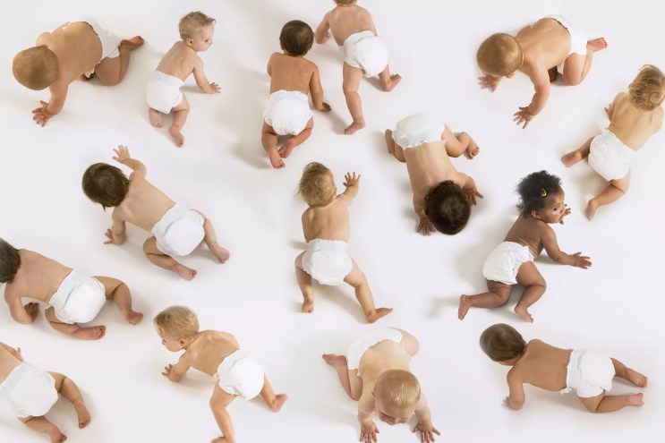 a bunch of babies crawling in diapers