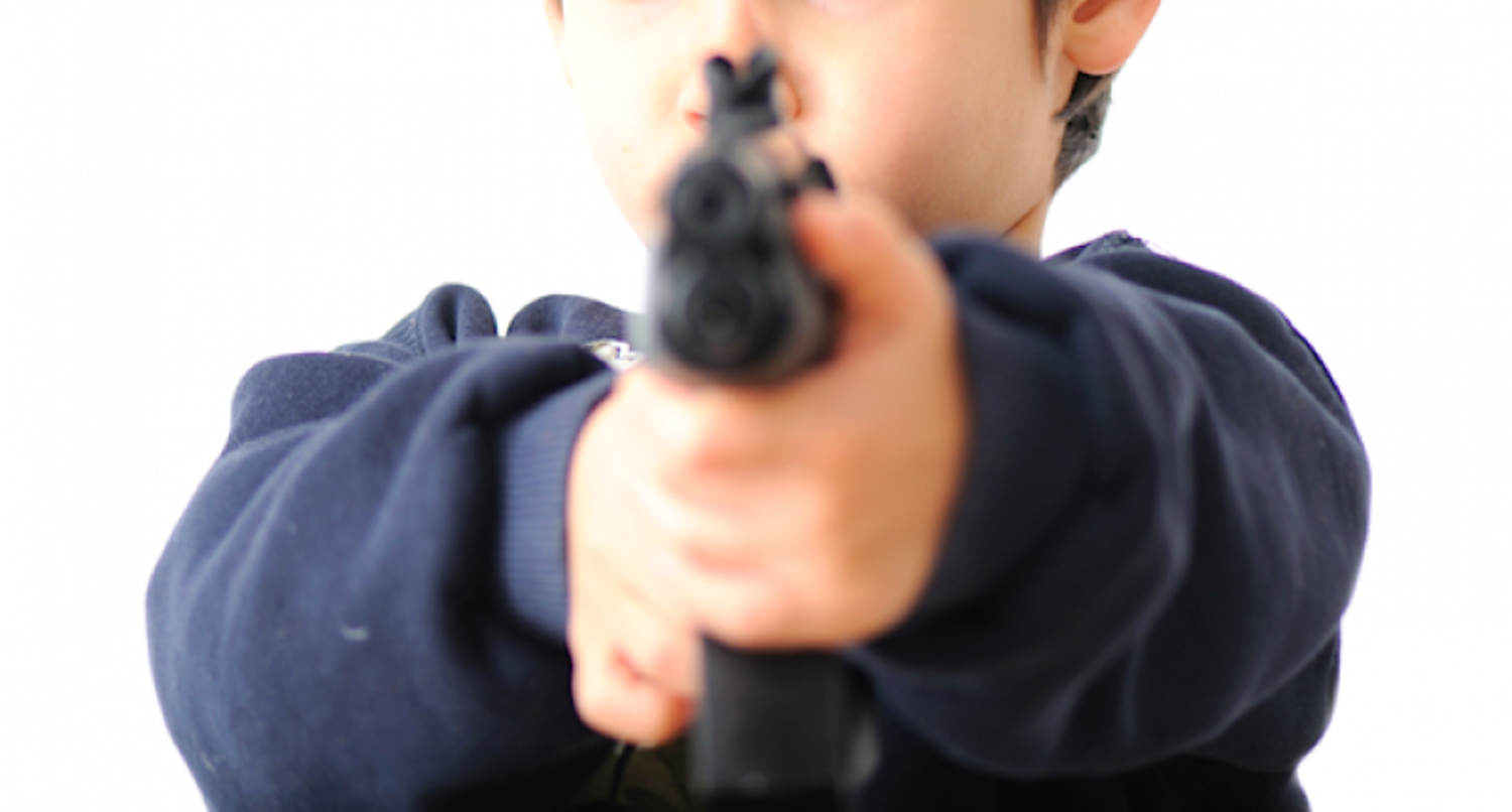 a child pointing a gun