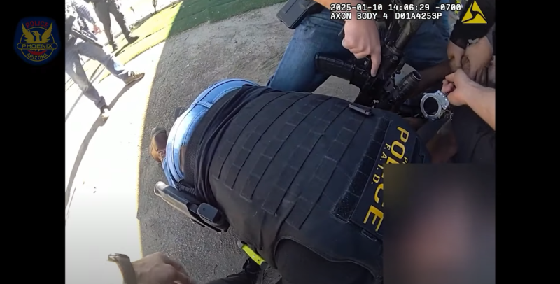 body-cam footage of a man being arrested by a host of officers