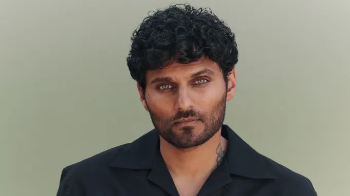 A headshot of an Indian man.