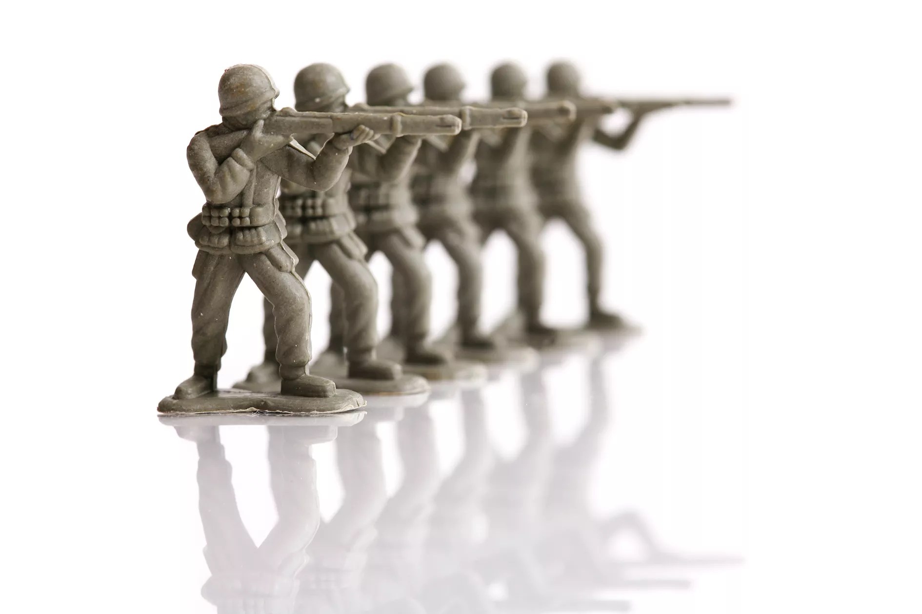 toy soldiers lined up in a firing squad