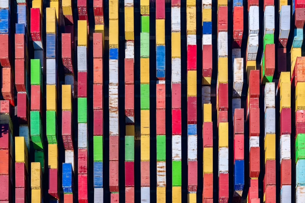 An aerial photograph of trucks or shipping containers.