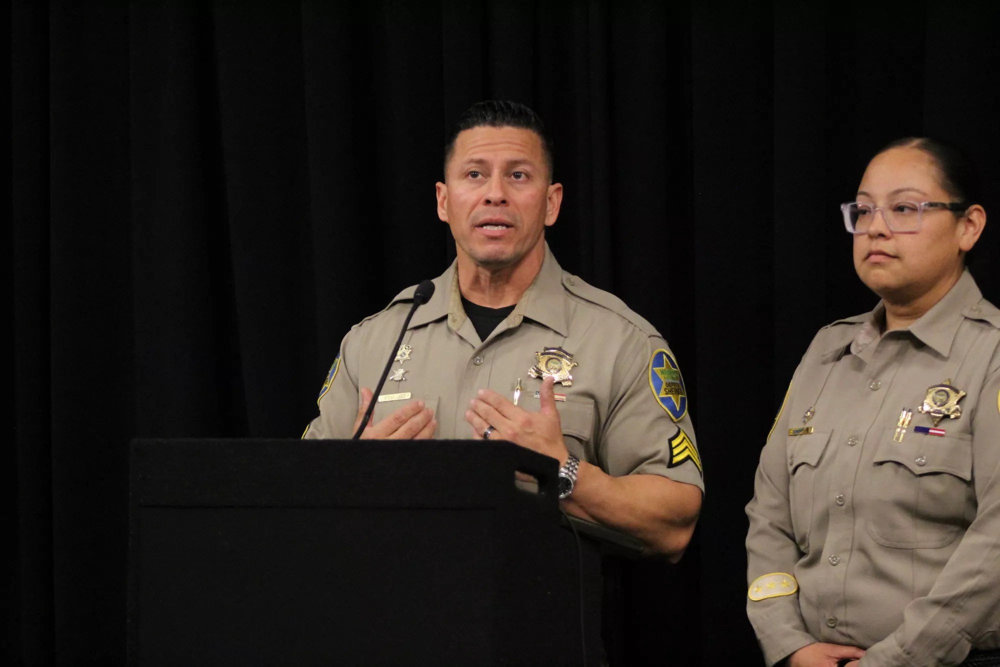 two sheriff's office employees in uniform