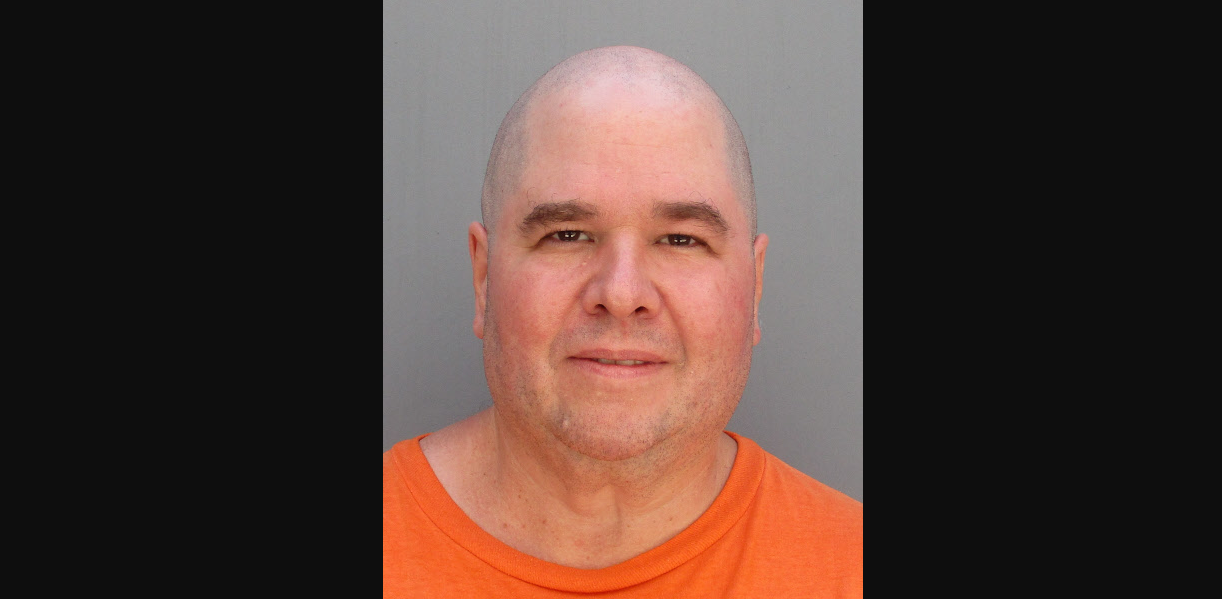 a mugshot of a bald man