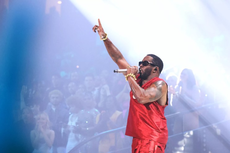 P Diddy performing in a red jersey