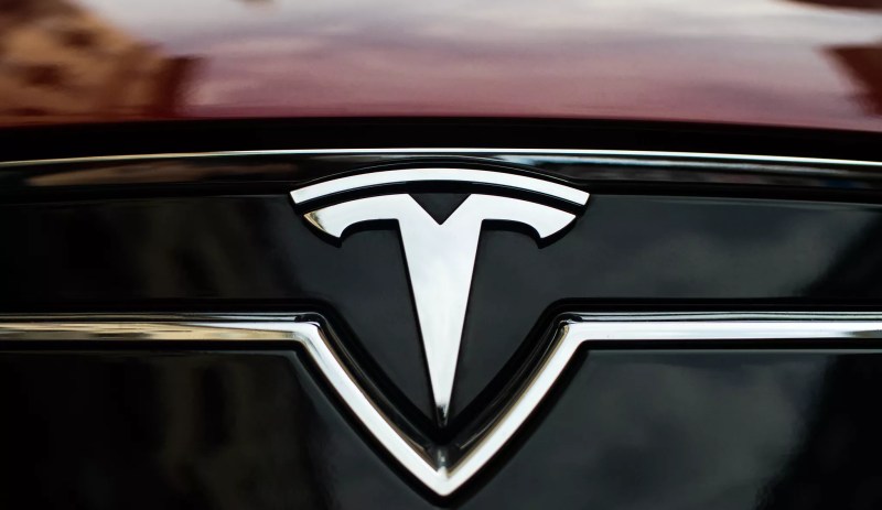 a tesla logo on the front of a car