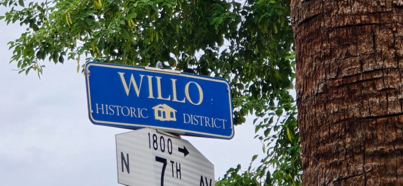 a blue street sign in the willo historic district