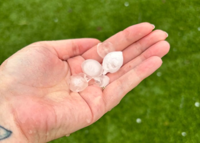 a hand holding hail stones